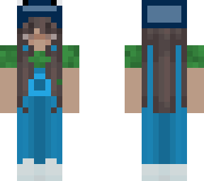 girl in overalls, green shirt and a whale hat