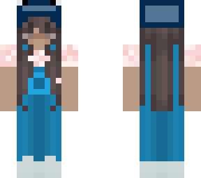 girl in overalls and a whale hat