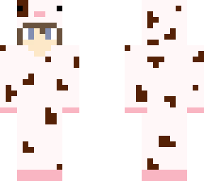 boy with brown hair in a cow onesie