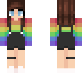 brunette girl in overalls and rainbow sweather