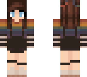 brunette girl in rainbow shirt and overalls