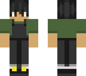 person with black overalls + green shirt