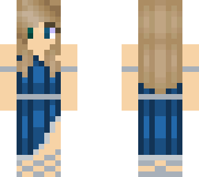 blonde girl in dark blue dress with a silver accent and a flower in her hair