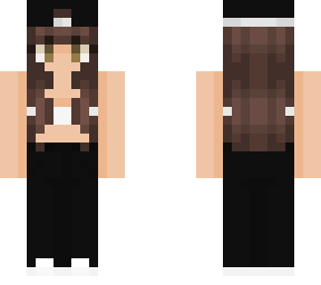 . brunette with white bralette and black jeans and a hat