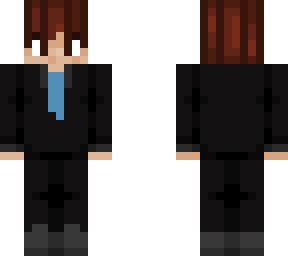 man with a black suit and red/brown hair