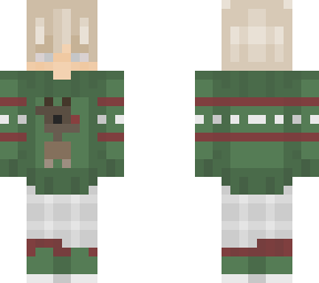 blonde boy in a green christmas sweater